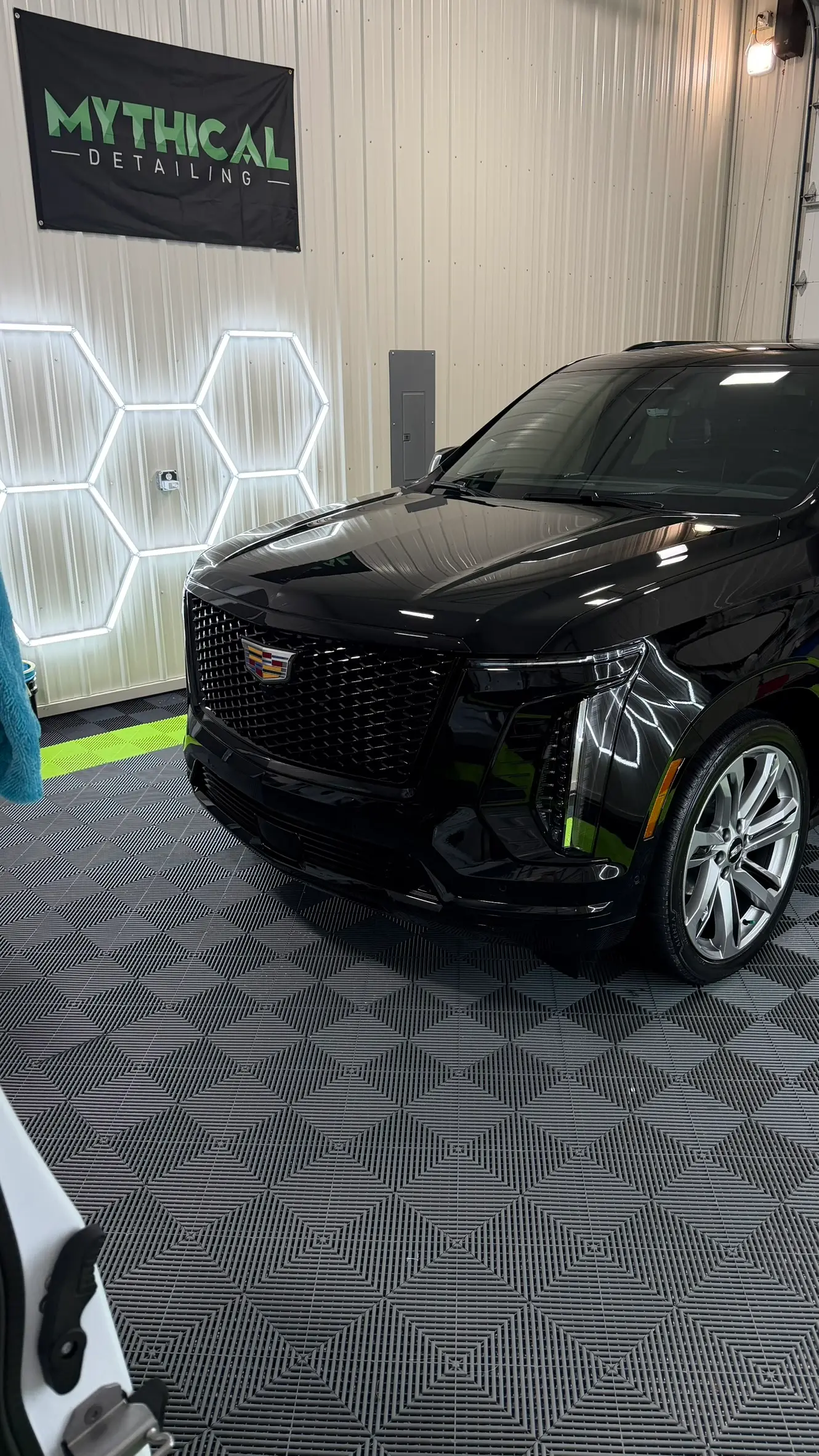 Black Cadillac Escalade in Mythical Detailing studio after full detail